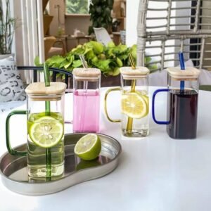 Glass cup with straw